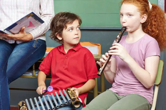 Children having music lessons in school