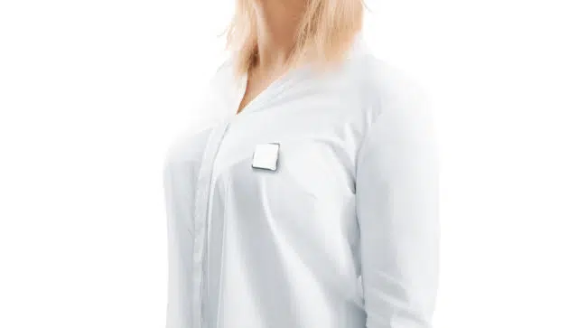 Blank white square silver lapel badge mockup on woman chest