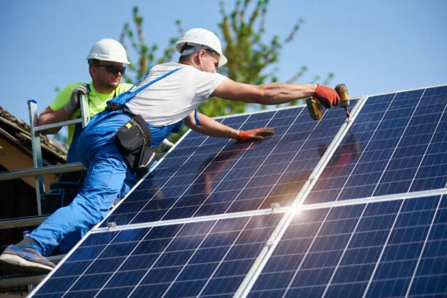 Stand-alone exterior solar panel system installation, renewable green energy generation concept.