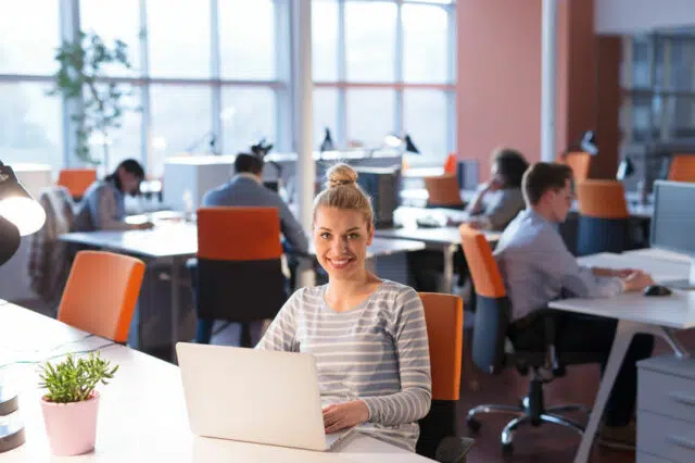 businesswoman using a laptop in startup office