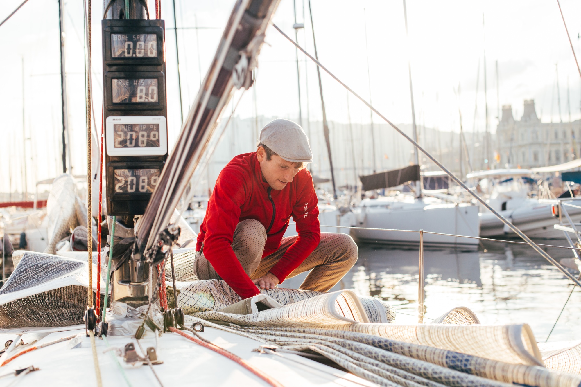 Sailor cleans and washes yacht after race