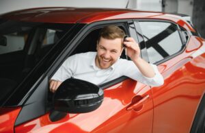 Man buying a car at a showroom