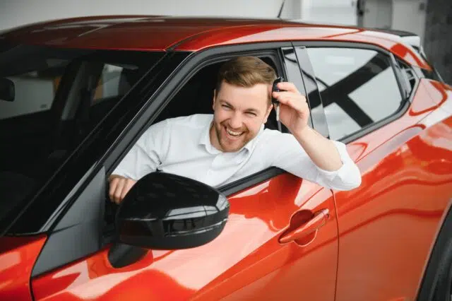 Man buying a car at a showroom Man buying a car at a showroom
