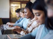 Black woman, education and student with university, study with laptop and research for project in c