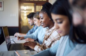 Black woman, education and student with university, study with laptop and research for project in c