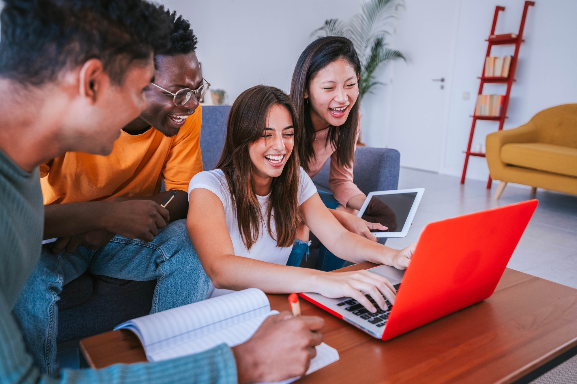 University students studying together with pc laptop