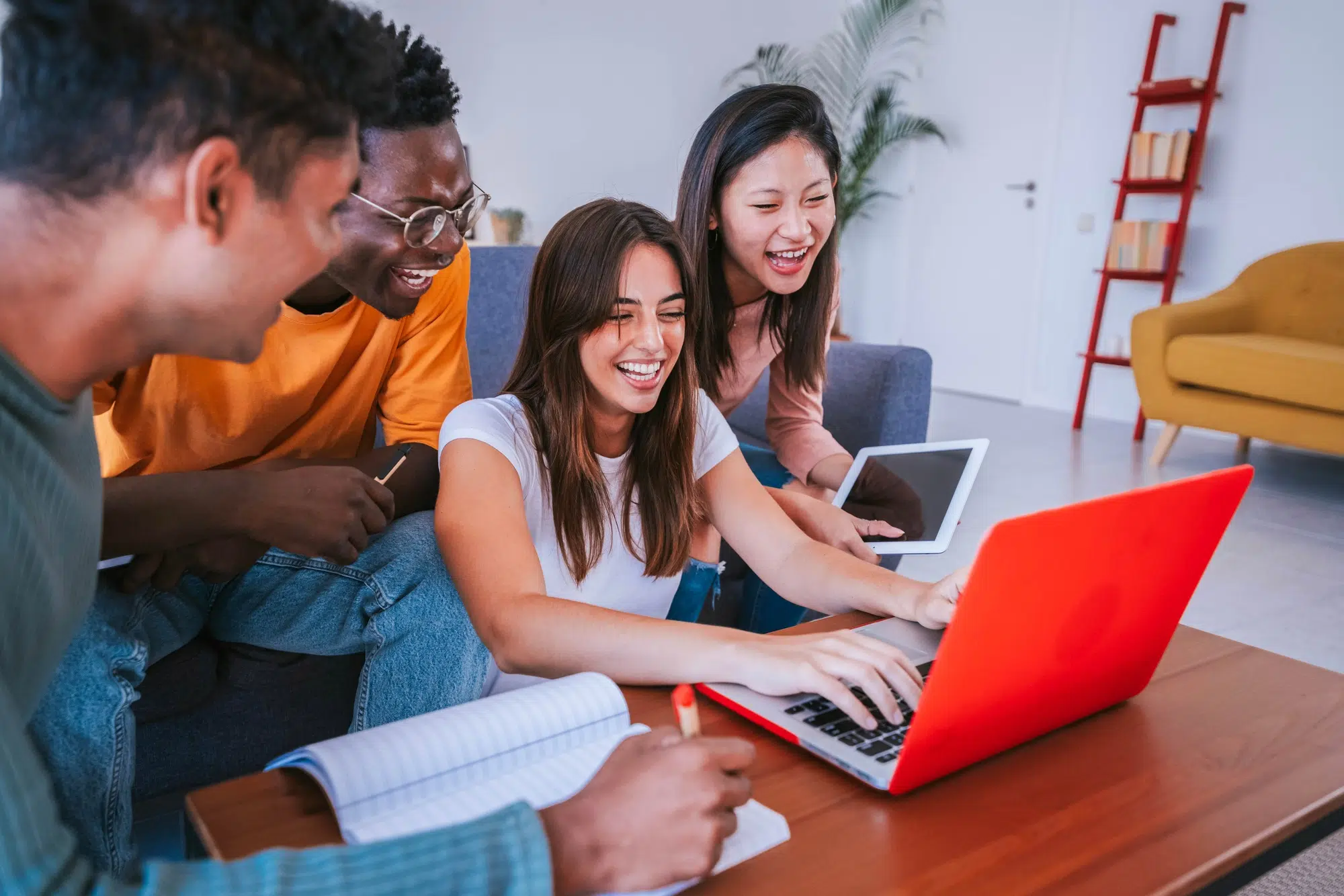 University students studying together with pc laptop